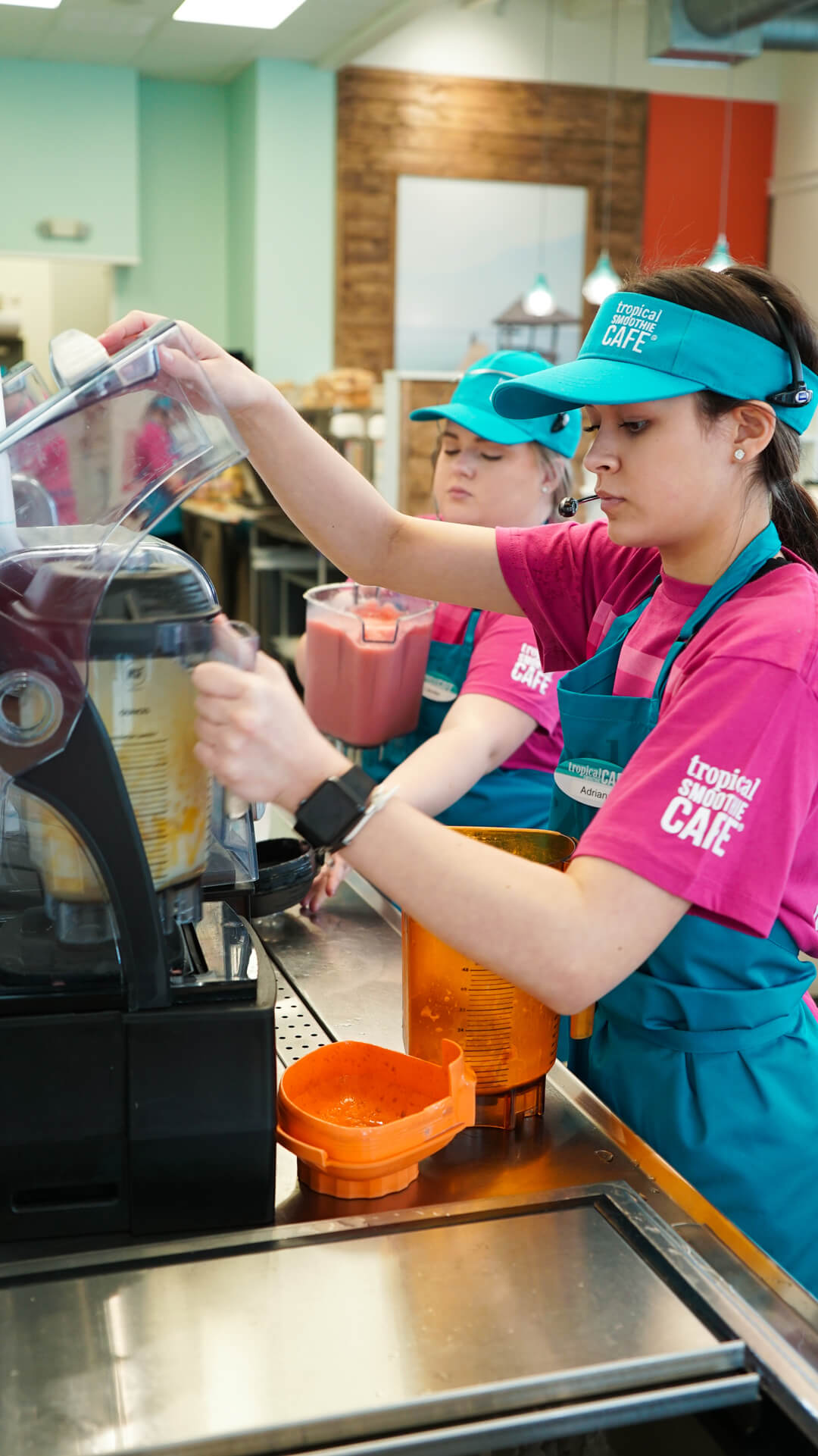 Tropical Smoothie Team Member Making a Smoothie